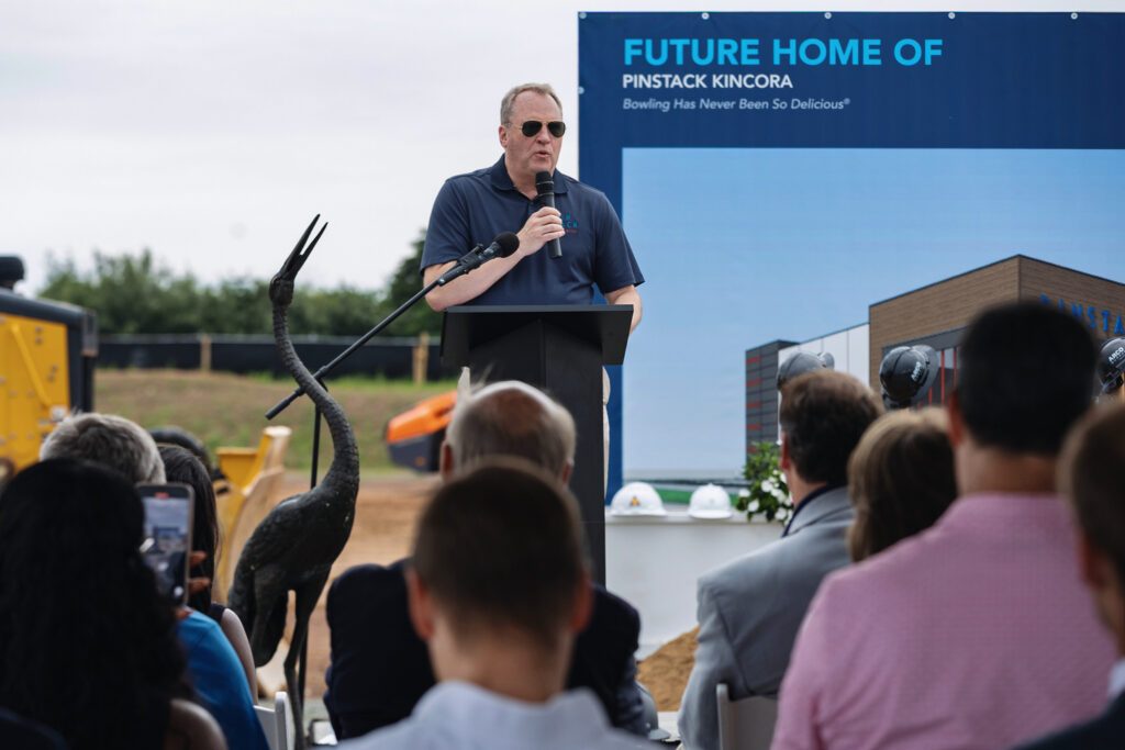 Mark Moore, President and CEO of PINSTACK, speaking to attendees at the groundbreaking ceremony.

