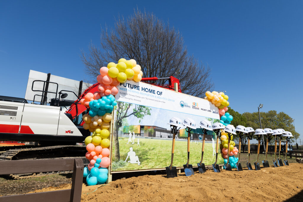 Set up of the backdrop and shovels at the groundbreaking ceremony