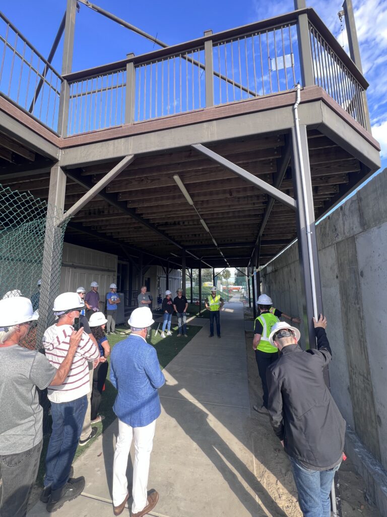 Individuals touring the EpicSurf installation at Heroes Paradise.