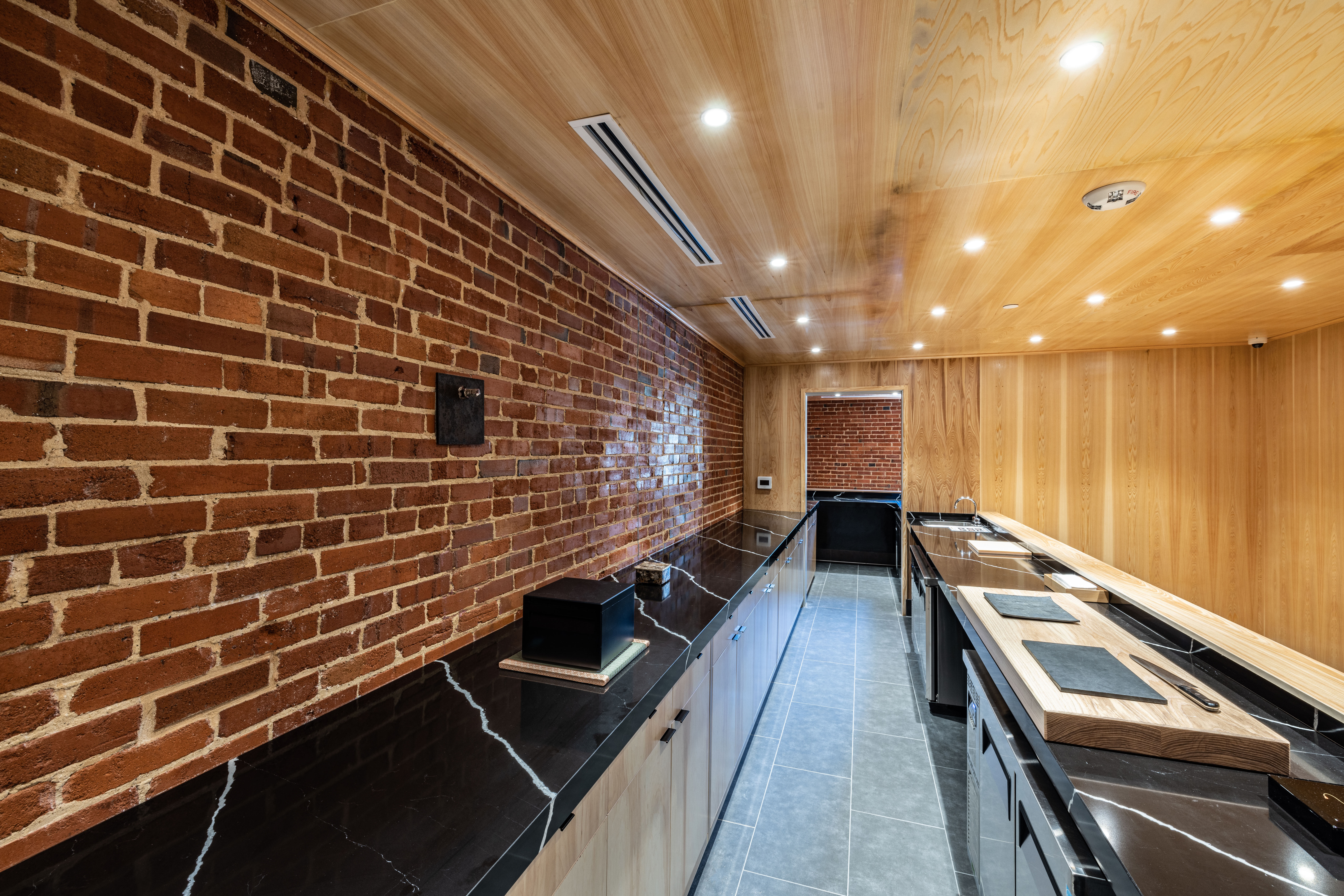 Intimate Michelin Star Japanese Restaurant Construction Buildout Inside the Historic Continental Gin Building - Adaptive Reuse Conversion by ARCO/Murray - Photo of the Sushi Counter